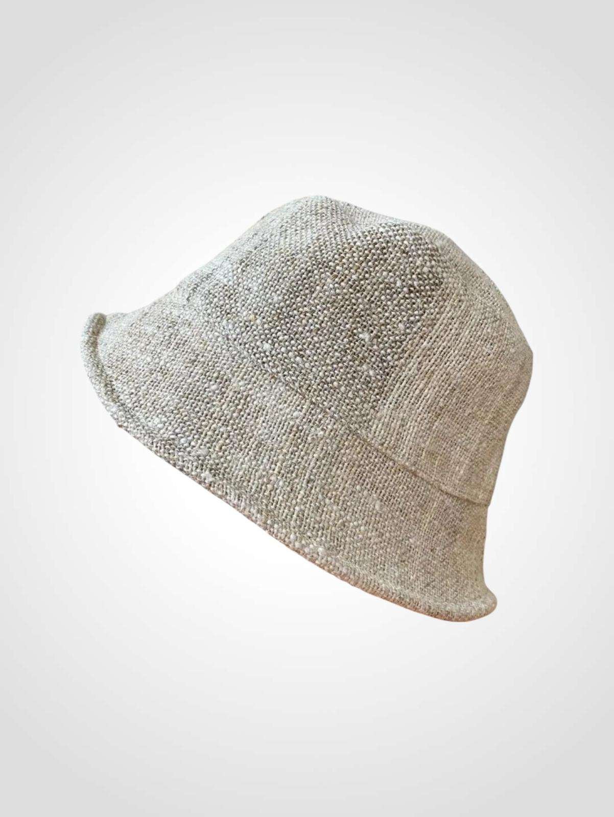 beige hemp bucket hat in plain background