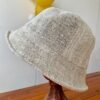 Beige hemp hat on stand