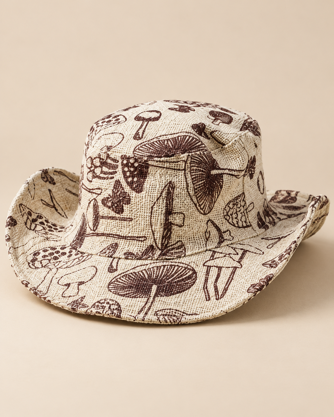 Large Mushroom Print Hemp Hat in natural beige with mushroom patterns, showing the woven hemp crown and wide brim from above.
