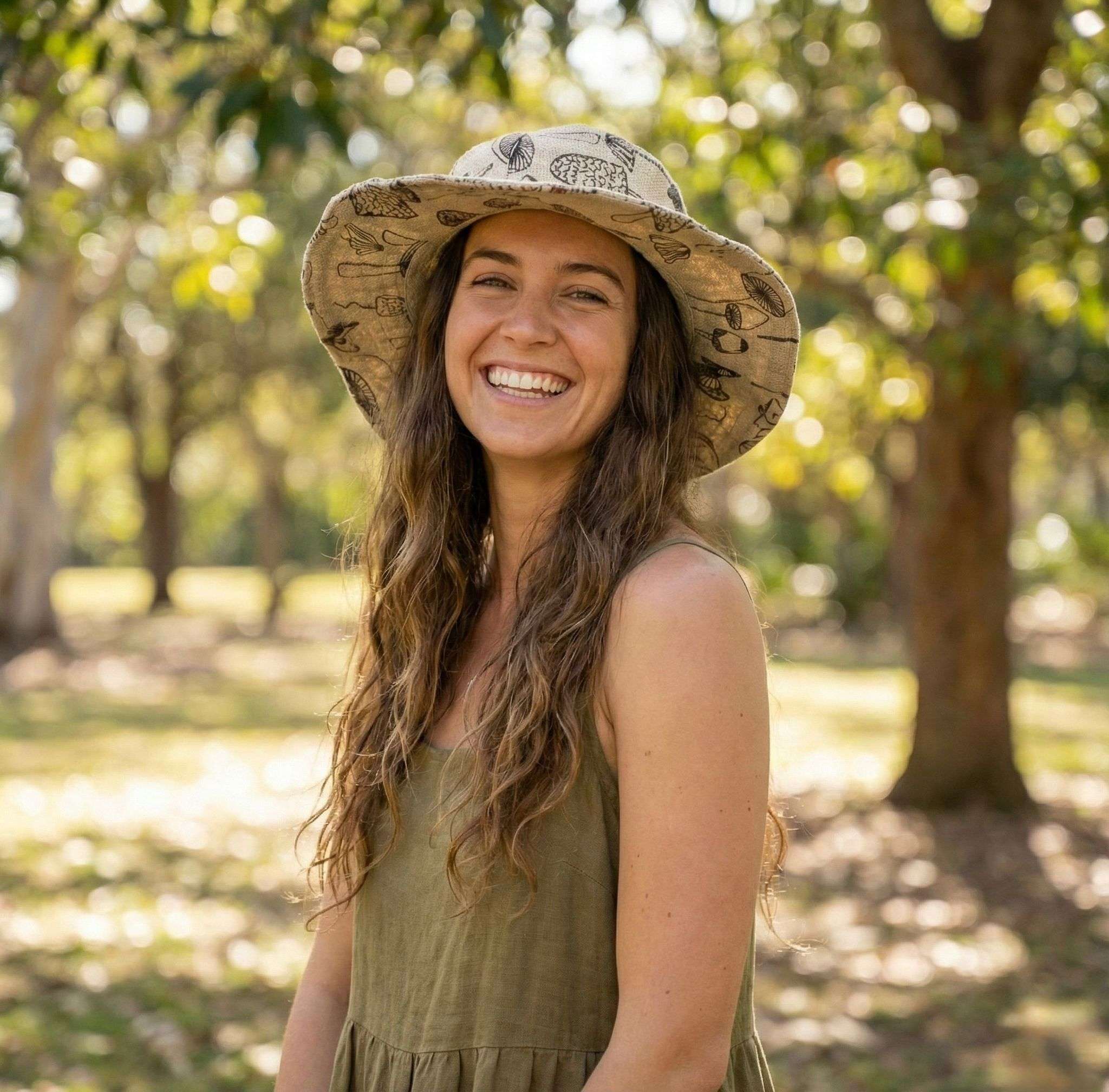 mushroom printed hemp hat worn by a woman in a park