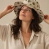 Hemp leaves small print hat worn by female model