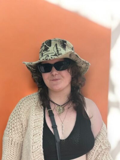 a women wearing mushroom printed hemp hat