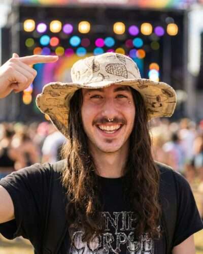 mushroom printed hat worn by a man in a festival