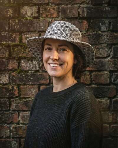 a woman wearing cobweb hemp hat