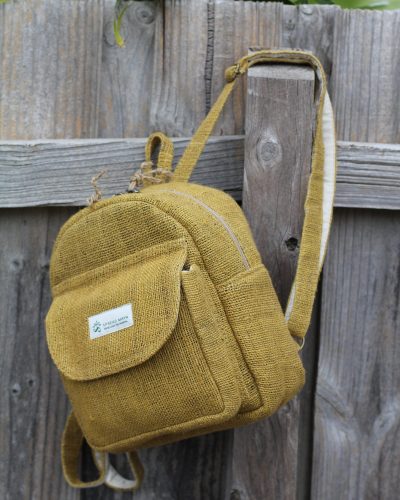 Hempster mini backpack hanging on the fence