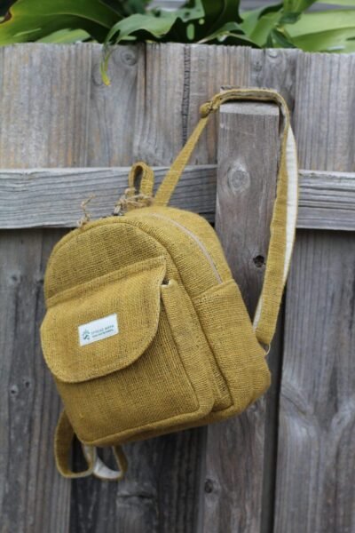 Hempster mini backpack hanging on the fence