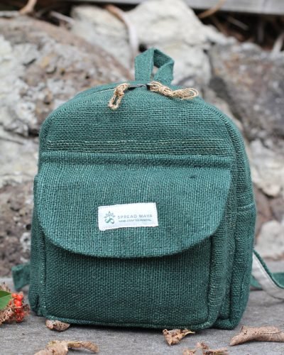 Hempster Green Mini Backpack front on the ground