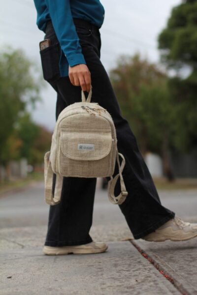 beige hemp mini backpack carrying by the hook of the bag