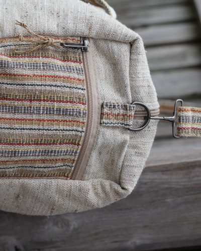 Side view of Spread Maya's handmade hemp duffle bag