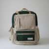 green maternity hemp backpack in plain background