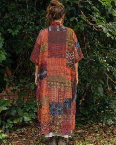 a woman wearing boho soul drape and posing from back