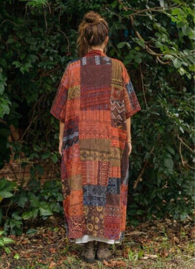 a woman wearing boho soul drape and posing from back