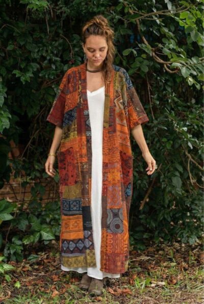 a woman wearing Spreadmaya boho outer and posing in nature