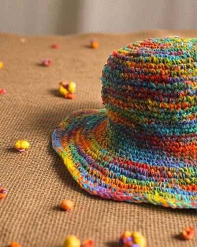 Colorful hemp hat on a beige creamy background