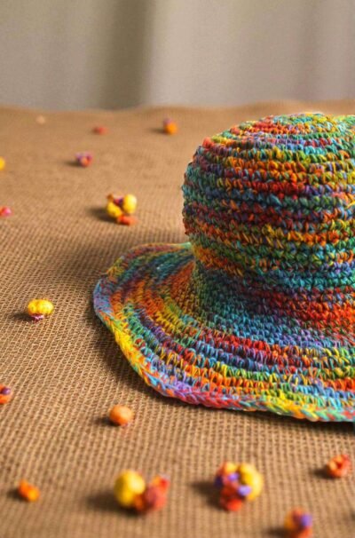 Colorful hemp hat on a beige creamy background