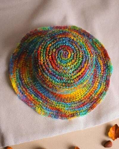 Colorful hemp hat on a beige creamy background