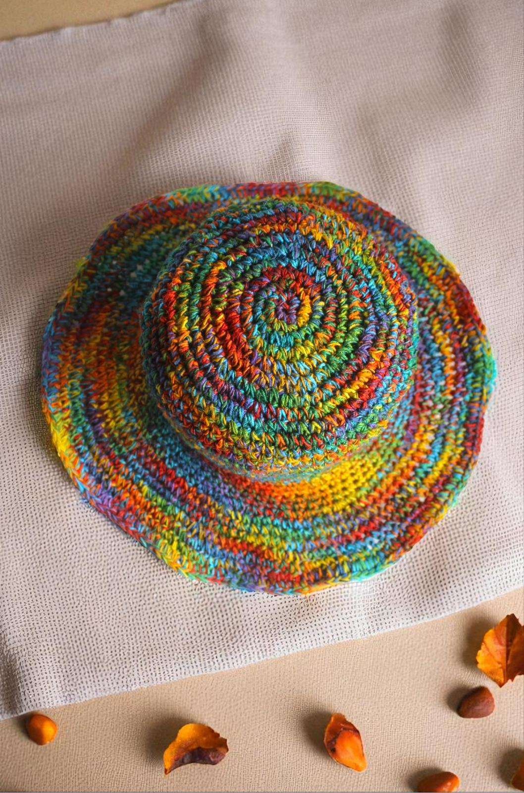 Colorful hemp hat on a beige creamy background