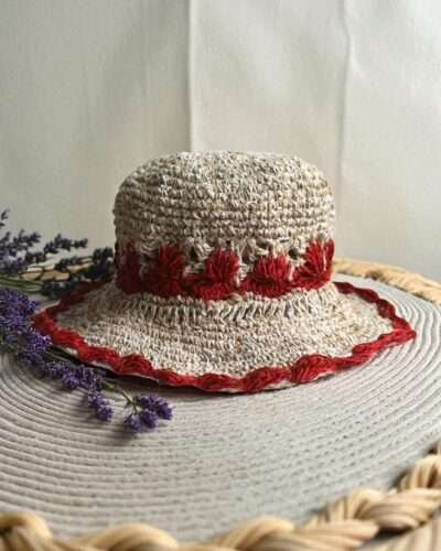 Gurkha looms red crochet hat on table