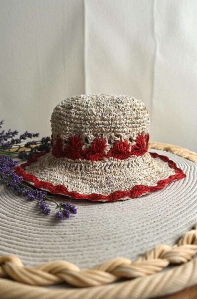 Gurkha looms red crochet hat on table