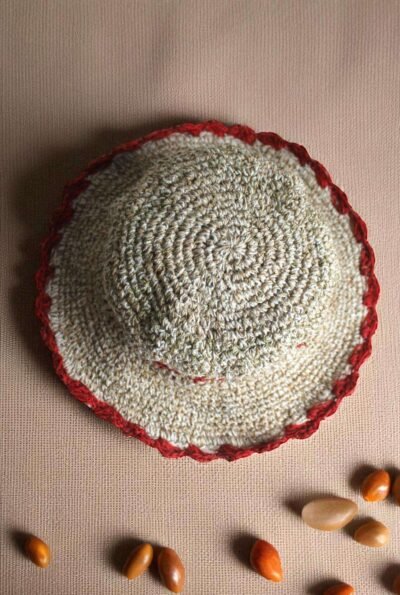 Gurkha looms red crochet hat on table top view