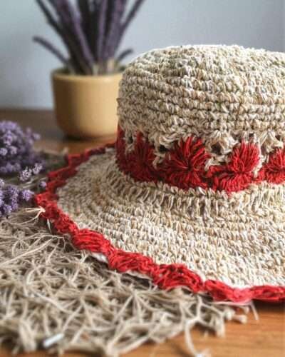 Gurkha looms red crochet hat on table zoom