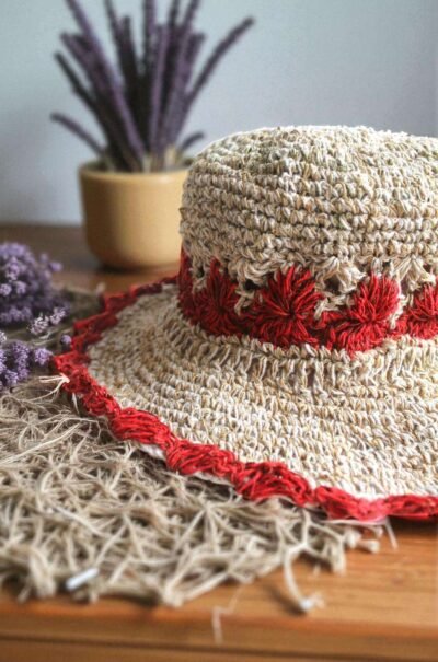 Gurkha looms red crochet hat on table zoom