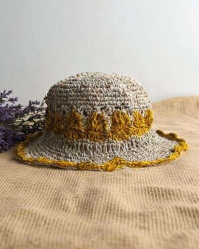 yellow flower Crochet hemp hat on table