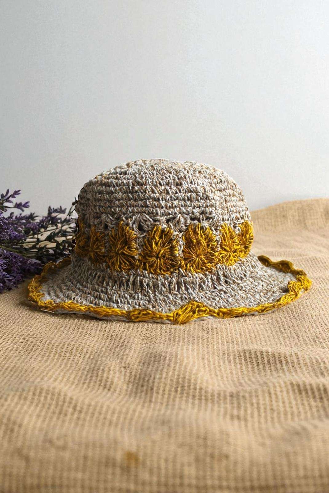 yellow flower Crochet hemp hat on table