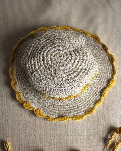 yellow flower Crochet hemp hat on table