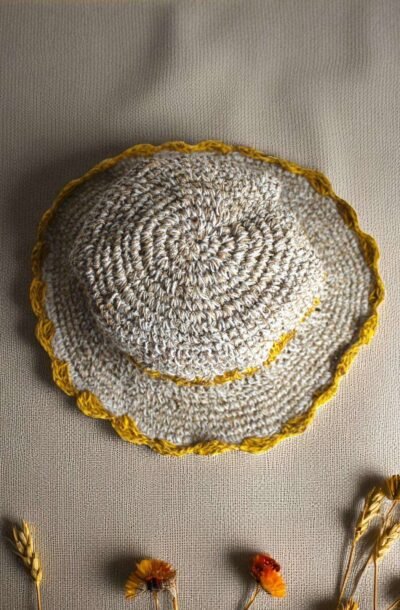 yellow flower Crochet hemp hat on table