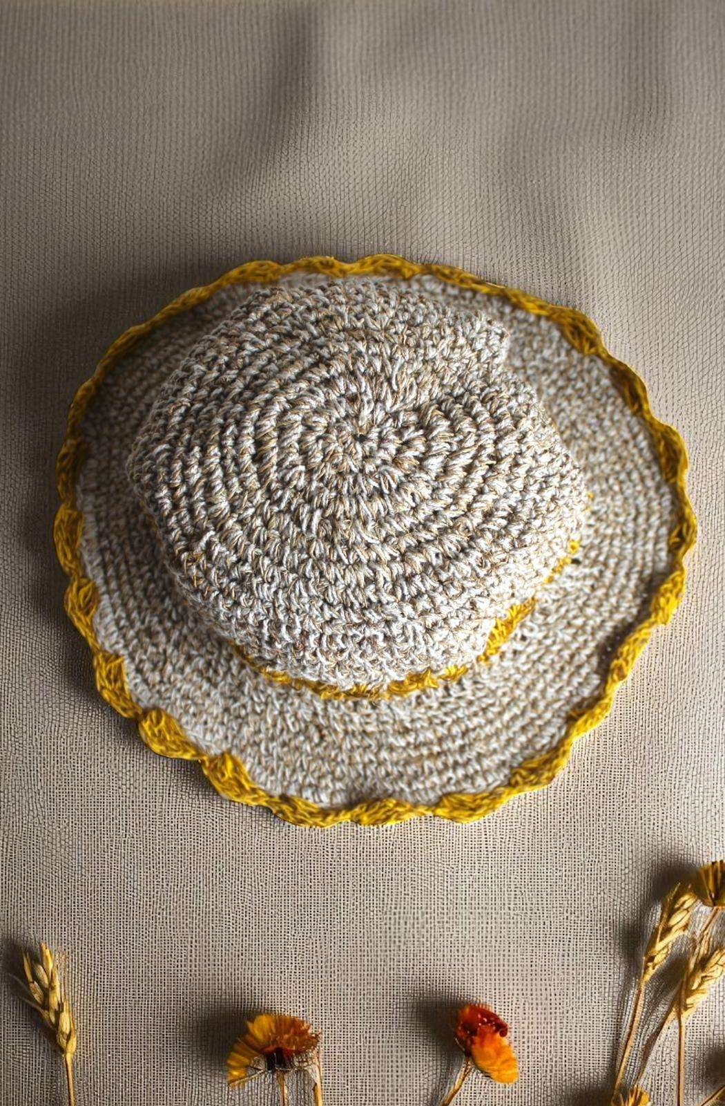 yellow flower Crochet hemp hat on table