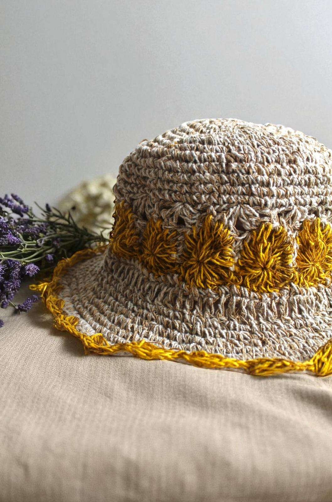 yellow flower Crochet hemp hat on table