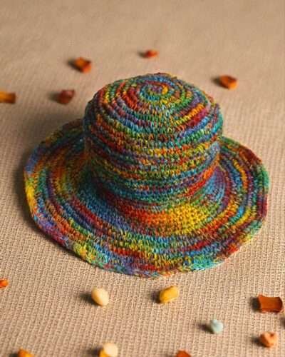 Colorful hemp hat on a beige creamy background