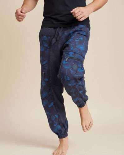 a man dancing in mushroom printed trousers