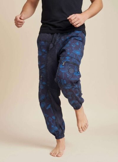 a man dancing in mushroom printed trousers