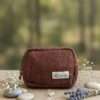 hemp travel pouch brown on a table front