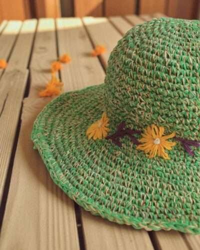 Kumari Crochet Hat Green displayed on the table zoom