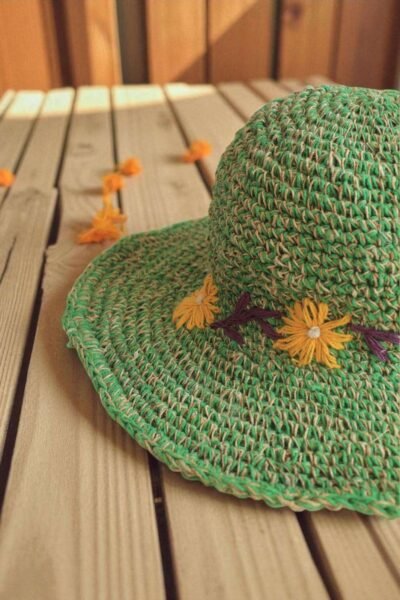 Kumari Crochet Hat Green displayed on the table zoom