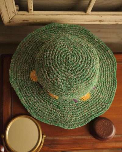Kumari Crochet Hat Green displayed on the table top view