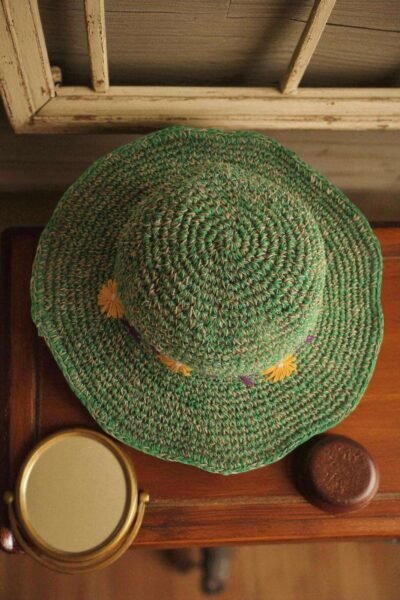 Kumari Crochet Hat Green displayed on the table top view