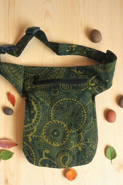 Green Cotton Bum Bag laid flat on a wooden surface