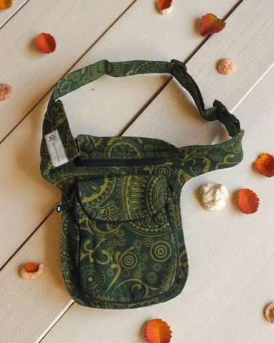 Green Cotton Bum Bag laid flat on a wooden surface