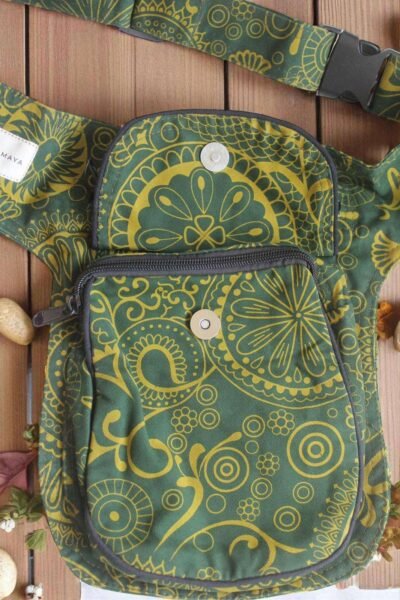 Green Cotton Bum Bag laid flat on a wooden surface