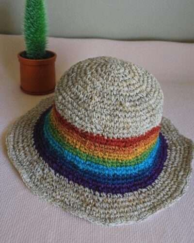 rainbow bordered hemp hat placed on a table