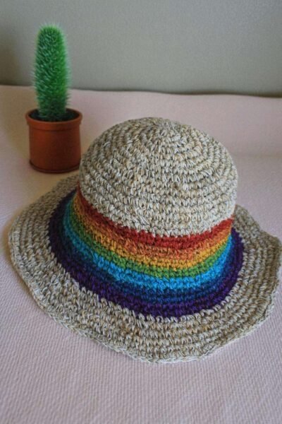 rainbow bordered hemp hat placed on a table
