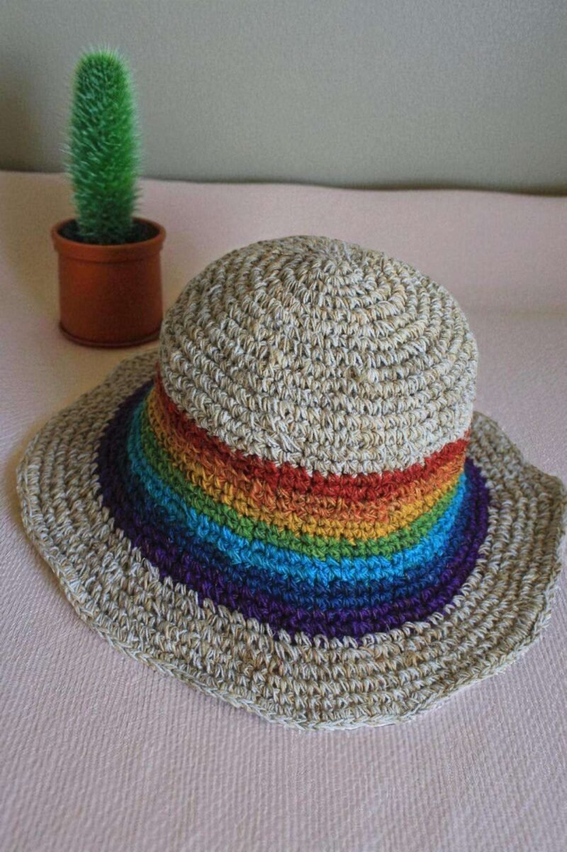 rainbow bordered hemp hat placed on a table