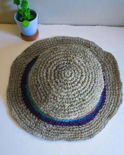 rainbow bordered hemp hat placed on a table