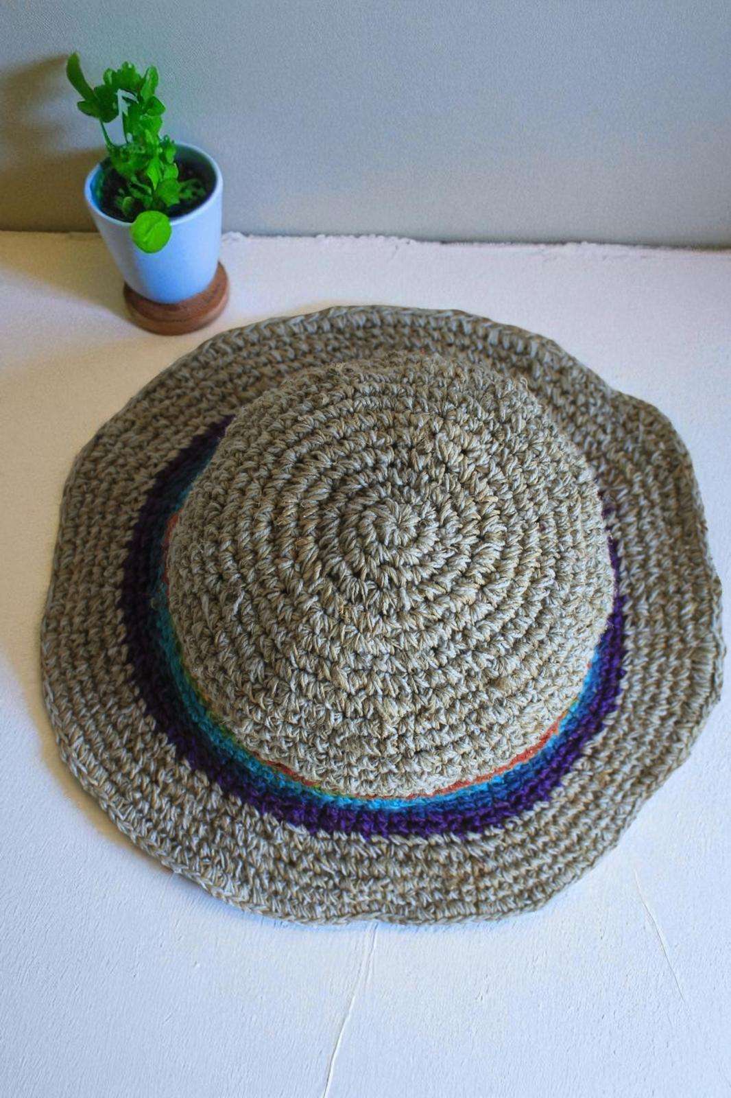 rainbow bordered hemp hat placed on a table