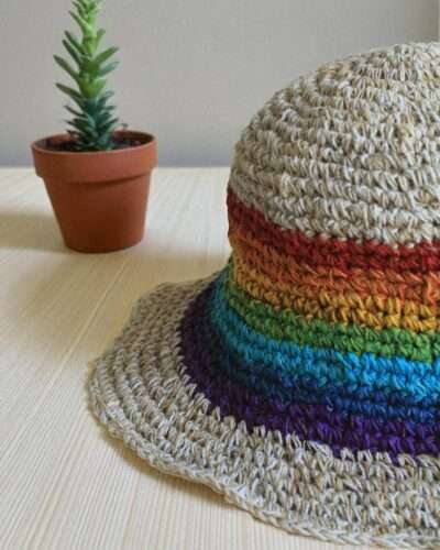 rainbow bordered hemp hat placed on a table