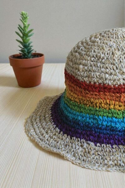 rainbow bordered hemp hat placed on a table